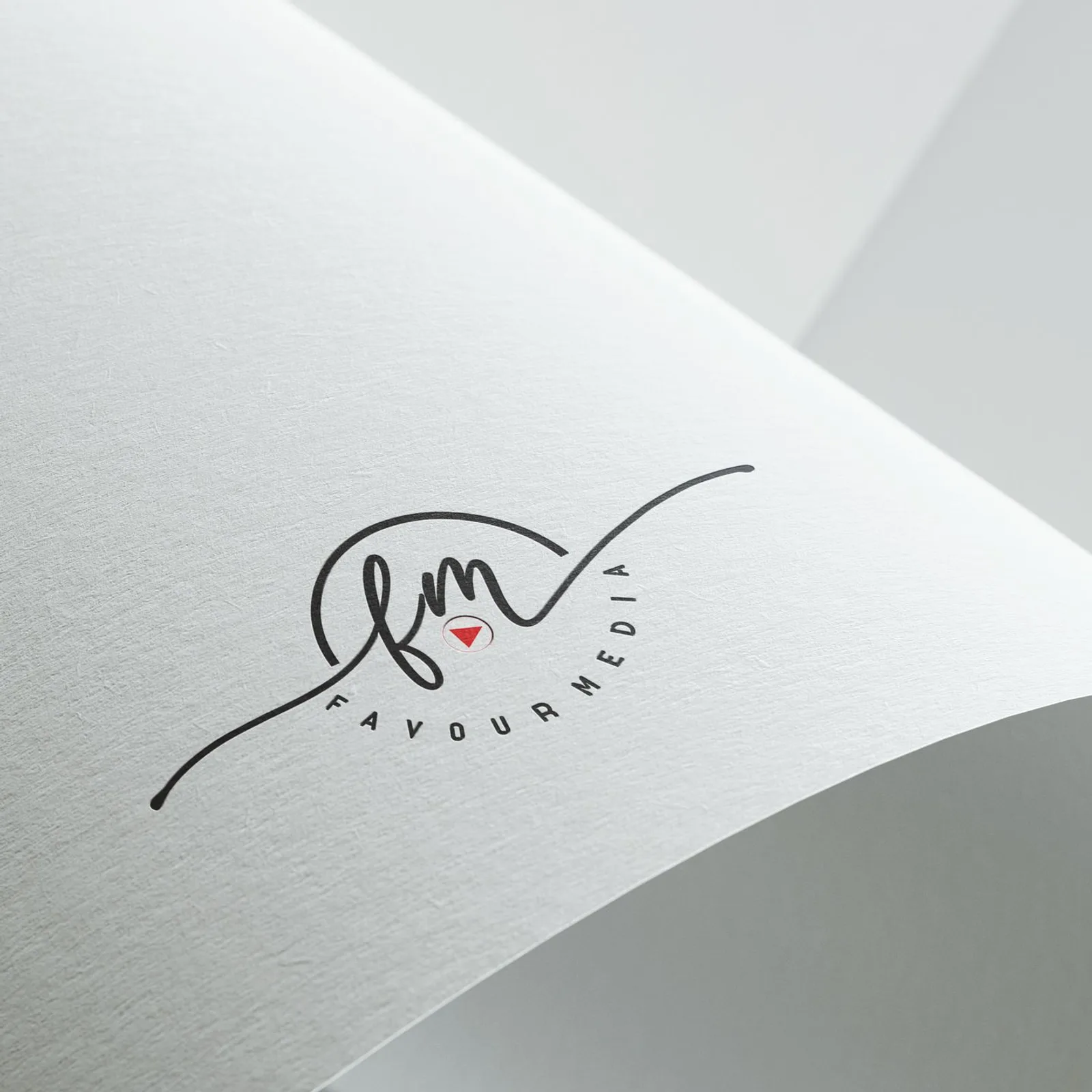A printed logo design mockup on curved white card