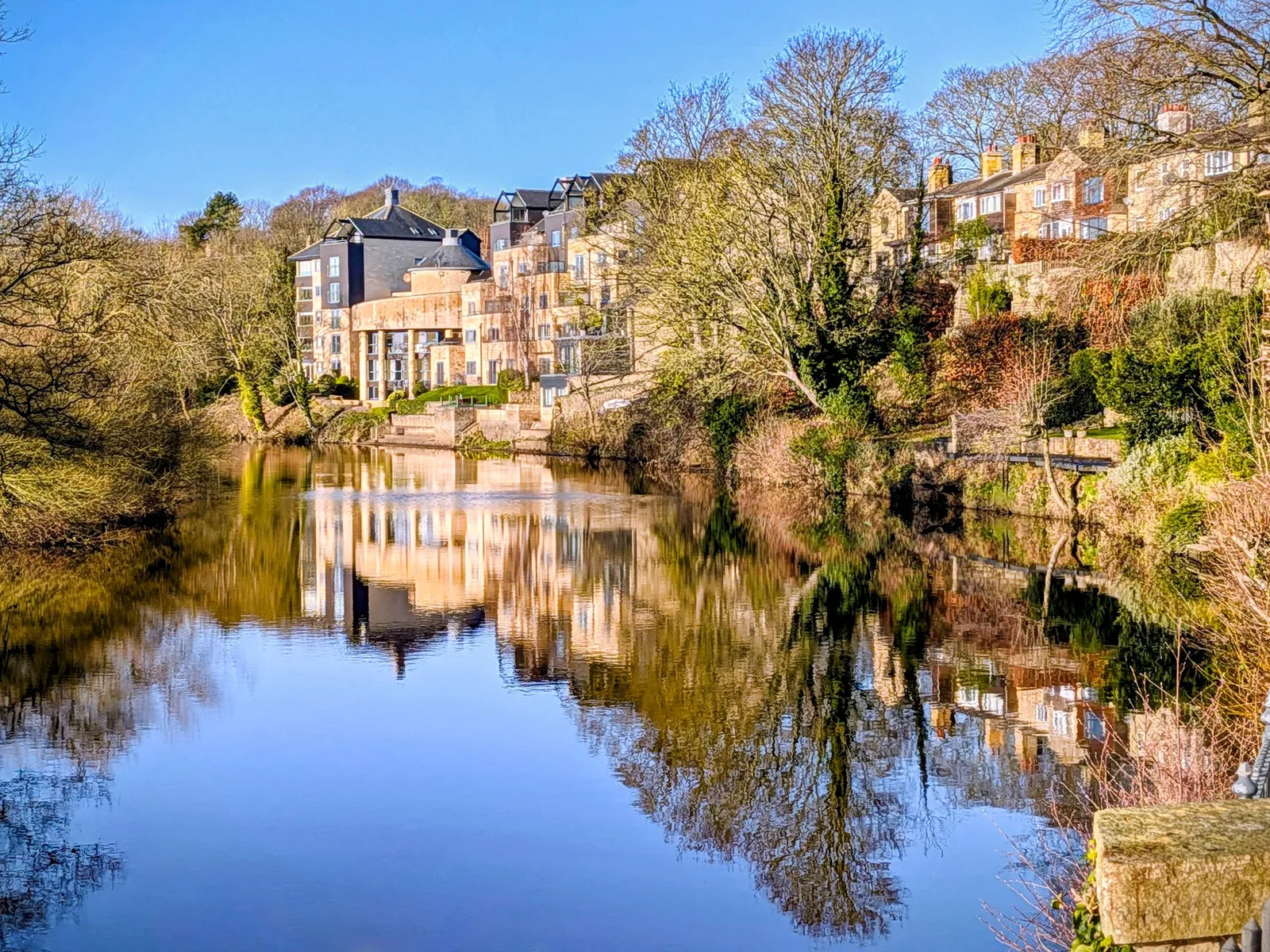 Riverside buildings reflected in the River Wharfe at Wetherby